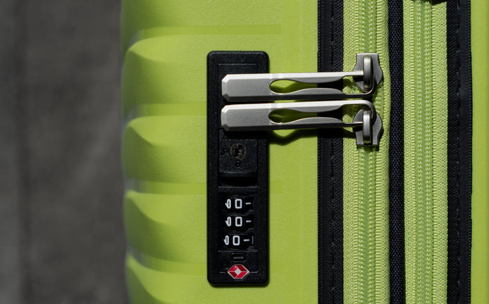 Comment changer le code d'un cadenas à combinaison sur ma valise ?